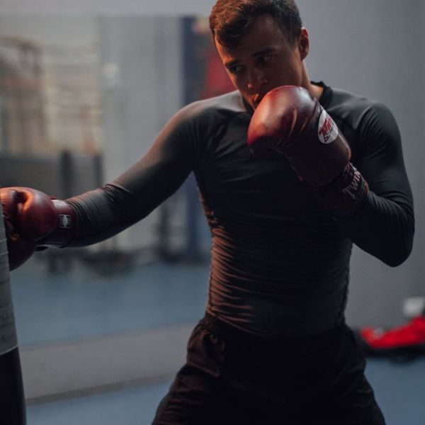 Fit man looking energized and focused after a workout.